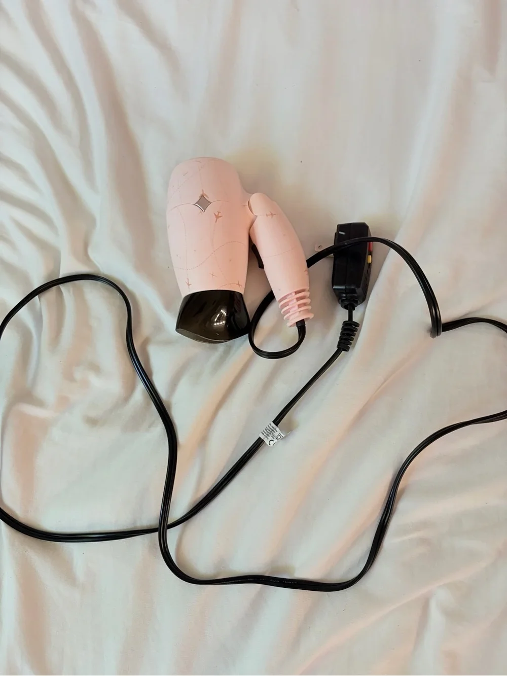 Compact Pink Travel Hair Dryer with Black Nozzle